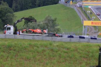 World © Octane Photographic Ltd. Scuderia Ferrari SF15-T– Sebastian Vettel's car is craned clear with Kimi Raikkonen's car on track in the background. Friday 19th June 2015, F1 Austrian GP Practice 1, Red Bull Ring, Spielberg, Austria. Digital Ref: 1304CB7D3278