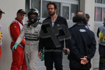 World © Octane Photographic Ltd. Mercedes AMG Petronas F1 W06 Hybrid – Nico Rosberg walks back to the pits. Saturday 20th June 2015, F1 Qualifying, Red Bull Ring, Spielberg, Austria. Digital Ref: 1312LB1D8378