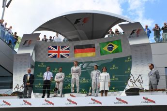 World © Octane Photographic Ltd. Mercedes AMG Petronas F1 W06 Hybrid – Nico Rosberg, Lewis Hamilton and Williams Martini Racing FW37 – Felipe Massa. Sunday 21st June 2015, F1 Race Podium, Red Bull Ring, Spielberg, Austria. Digital Ref: 1320LW1L4219