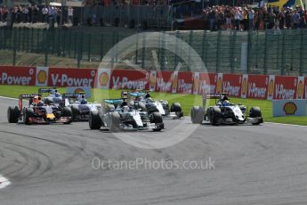 World © Octane Photographic Ltd. Mercedes AMG Petronas F1 W06 Hybrid – Lewis Hamilton and Sahara Force India VJM08B – Sergio Perez side by side into La Source hairpin on lap 1. Sunday 23rd August 2015, F1 Belgian GP Race, Spa-Francorchamps, Belgium. Digital Ref: 1389LB1D2028