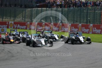 World © Octane Photographic Ltd. Mercedes AMG Petronas F1 W06 Hybrid – Lewis Hamilton and Sahara Force India VJM08B – Sergio Perez side by side into La Source hairpin on lap 1. Sunday 23rd August 2015, F1 Belgian GP Race, Spa-Francorchamps, Belgium. Digital Ref: 1389LB1D2032