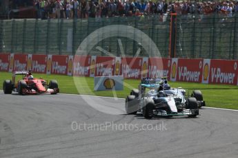 World © Octane Photographic Ltd. Mercedes AMG Petronas F1 W06 Hybrid – Nico Rosberg and Williams Martini Racing FW37 – Valtteri Bottas. Sunday 23rd August 2015, F1 Belgian GP Race, Spa-Francorchamps, Belgium. Digital Ref: 1389LB1D2117