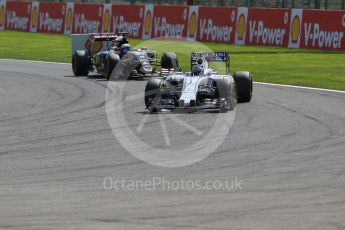 World © Octane Photographic Ltd. Williams Martini Racing FW37 – Valtteri Bottas and Lotus F1 Team E23 Hybrid – Romain Grosjean. . Sunday 23rd August 2015, F1 Belgian GP Race, Spa-Francorchamps, Belgium. Digital Ref: 1389LB1D2187