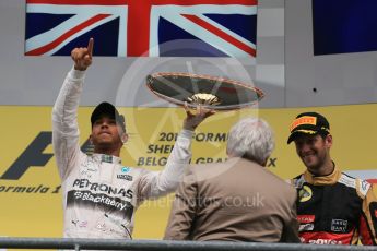 World © Octane Photographic Ltd. Mercedes AMG Petronas F1 W06 Hybrid – Lewis Hamilton (1st) and Lotus F1 Team E23 Hybrid – Romain Grosjean (3rd). Sunday 23rd August 2015, F1 Belgian GP Podium, Spa-Francorchamps, Belgium. Digital Ref: 1390LB1D2341
