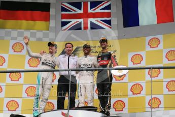 World © Octane Photographic Ltd. Mercedes AMG Petronas F1 W06 Hybrid – Lewis Hamilton (1st), Nico Rosberg (2nd) and Lotus F1 Team E23 Hybrid – Romain Grosjean (3rd). Sunday 23rd August 2015, F1 Belgian GP Podium, Spa-Francorchamps, Belgium. Digital Ref: 1390LB1D2501
