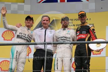 World © Octane Photographic Ltd. Mercedes AMG Petronas F1 W06 Hybrid – Lewis Hamilton (1st), Nico Rosberg (2nd) and Lotus F1 Team E23 Hybrid – Romain Grosjean (3rd). Sunday 23rd August 2015, F1 Belgian GP Podium, Spa-Francorchamps, Belgium. Digital Ref: 1390LB1D2520