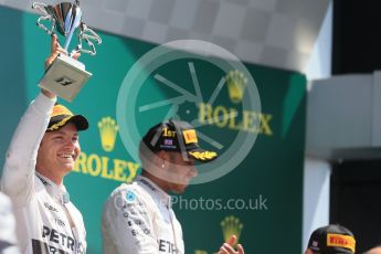 World © Octane Photographic Ltd. Mercedes AMG Petronas F1 W06 Hybrid – Nico Rosberg and Lewis Hamilton. Sunday 5th July 2015, F1 Podium, Silverstone, UK. Digital Ref: 1342LB1D6874