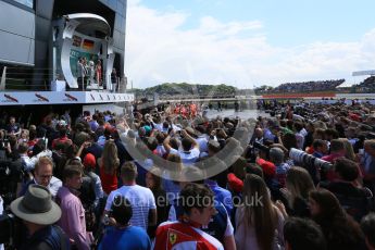 World © Octane Photographic Ltd. Media and team at the podium celebrations. Sunday 5th July 2015, F1 British GP Podium, Silverstone, UK. Digital Ref: 1342LB5D9983