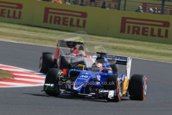 World © Octane Photographic Ltd. Sauber F1 Team Reserve Driver– Raffaele Marciello and Manor Marussia F1 Team MR03B – Roberto Merhi. Friday 3rd July 2015, F1 British GP Practice 1 Silverstone, UK. Digital Ref: 1327LB1D3371