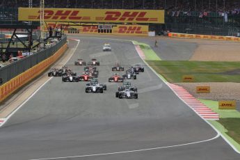 World © Octane Photographic Ltd. The F1 Grid lead by Williams Martini Racing FW37 – Felipe Massa. after he made a better start than Mercedes AMG Petronas F1 W06 Hybrid – Lewis Hamilton Sunday 5th July 2015, F1 British GP Race, Silverstone, UK. Digital Ref: 1341LB1D6414