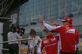 World © Octane Photographic Ltd. Scuderia Ferrari SF15-T– Sebastian Vettel and Kimi Raikkonen. Sunday 5th July 2015, F1 British GP Race - Grid, Silverstone, UK. Digital Ref: 1340LB1D6315