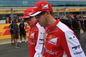 World © Octane Photographic Ltd. Scuderia Ferrari SF15-T– Sebastian Vettel and Kimi Raikkonen. Sunday 5th July 2015, F1 British GP Race - Grid, Silverstone, UK. Digital Ref: 1340LB5D9759