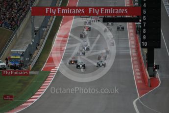 World © Octane Photographic Ltd. Mercedes AMG Petronas F1 W06 Hybrid – Nico Rosberg and Lewis Hamilton battle up to turn 1. Sunday 25th October 2015, F1 USA Grand Prix Race, Austin, Texas - Circuit of the Americas (COTA). Digital Ref: 1466LB1D1727