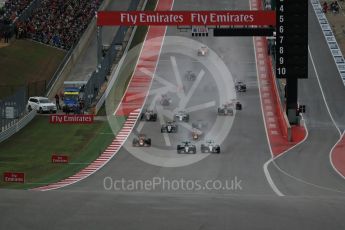 World © Octane Photographic Ltd. Mercedes AMG Petronas F1 W06 Hybrid – Nico Rosberg and Lewis Hamilton battle up to turn 1. Sunday 25th October 2015, F1 USA Grand Prix Race, Austin, Texas - Circuit of the Americas (COTA). Digital Ref: 1466LB1D1733