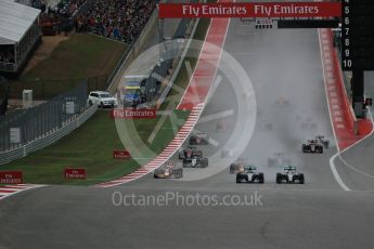 World © Octane Photographic Ltd. Mercedes AMG Petronas F1 W06 Hybrid – Nico Rosberg and Lewis Hamilton battle up to turn 1. Sunday 25th October 2015, F1 USA Grand Prix Race, Austin, Texas - Circuit of the Americas (COTA). Digital Ref: 1466LB1D1741