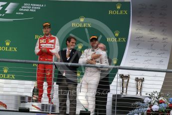 World © Octane Photographic Ltd. Mercedes AMG Petronas F1 W06 Hybrid – Lewis Hamilton and Scuderia Ferrari SF15-T– Sebastian Vettel. Sunday 25th October 2015, F1 USA Grand Prix Race - Podium, Austin, Texas - Circuit of the Americas (COTA). Digital Ref: 1467LB1D2599
