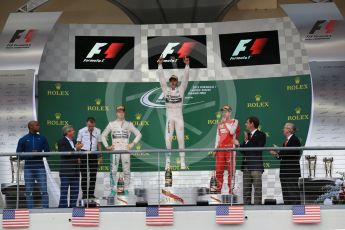 World © Octane Photographic Ltd. Mercedes AMG Petronas F1 W06 Hybrid – Lewis Hamilton, Nico Rosberg and Scuderia Ferrari SF15-T– Sebastian Vettel. Sunday 25th October 2015, F1 USA Grand Prix Race - Podium, Austin, Texas - Circuit of the Americas (COTA). Digital Ref: 1467LB1D2607