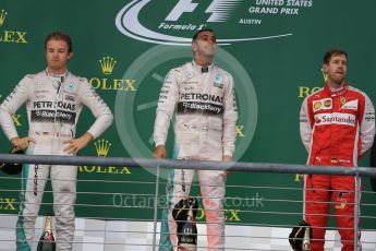 World © Octane Photographic Ltd. Mercedes AMG Petronas F1 W06 Hybrid – Lewis Hamilton, Nico Rosberg and Scuderia Ferrari SF15-T– Sebastian Vettel. Sunday 25th October 2015, F1 USA Grand Prix Race - Podium, Austin, Texas - Circuit of the Americas (COTA). Digital Ref: 1467LB1D2621