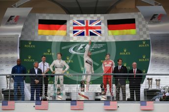 World © Octane Photographic Ltd. Mercedes AMG Petronas F1 W06 Hybrid – Lewis Hamilton, Nico Rosberg and Scuderia Ferrari SF15-T– Sebastian Vettel. Sunday 25th October 2015, F1 USA Grand Prix Race - Podium, Austin, Texas - Circuit of the Americas (COTA). Digital Ref: 1467LB1D2636