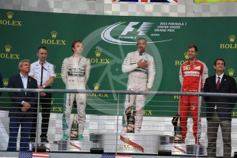 World © Octane Photographic Ltd. Mercedes AMG Petronas F1 W06 Hybrid – Lewis Hamilton, Nico Rosberg and Scuderia Ferrari SF15-T– Sebastian Vettel. Sunday 25th October 2015, F1 USA Grand Prix Race - Podium, Austin, Texas - Circuit of the Americas (COTA). Digital Ref: 1467LB1D2663