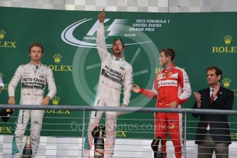 World © Octane Photographic Ltd. Mercedes AMG Petronas F1 W06 Hybrid – Lewis Hamilton, Nico Rosberg and Scuderia Ferrari SF15-T– Sebastian Vettel. Sunday 25th October 2015, F1 USA Grand Prix Race - Podium, Austin, Texas - Circuit of the Americas (COTA). Digital Ref: 1467LB1D2695
