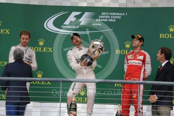 World © Octane Photographic Ltd. Mercedes AMG Petronas F1 W06 Hybrid – Lewis Hamilton, Nico Rosberg and Scuderia Ferrari SF15-T– Sebastian Vettel. Sunday 25th October 2015, F1 USA Grand Prix Race - Podium, Austin, Texas - Circuit of the Americas (COTA). Digital Ref: 1467LB1D2743
