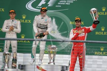 World © Octane Photographic Ltd. Mercedes AMG Petronas F1 W06 Hybrid – Lewis Hamilton, Nico Rosberg and Scuderia Ferrari SF15-T– Sebastian Vettel. Sunday 25th October 2015, F1 USA Grand Prix Race - Podium, Austin, Texas - Circuit of the Americas (COTA). Digital Ref: 1467LB1D2822