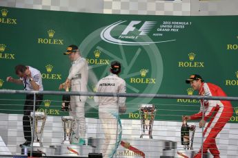 World © Octane Photographic Ltd. Mercedes AMG Petronas F1 W06 Hybrid – Lewis Hamilton, Nico Rosberg and Scuderia Ferrari SF15-T– Sebastian Vettel and Paddy Lowe from Mercedes AMG Petronas F1 team. Sunday 25th October 2015, F1 USA Grand Prix Race - Podium, Austin, Texas - Circuit of the Americas (COTA). Digital Ref: 1467LB1D2845