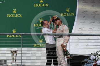 World © Octane Photographic Ltd. Mercedes AMG Petronas F1 W06 Hybrid - Lewis Hamilton and Paddy Lowe. Sunday 25th October 2015, F1 USA Grand Prix Race - Podium, Austin, Texas - Circuit of the Americas (COTA). Digital Ref: 1467LB1D2902