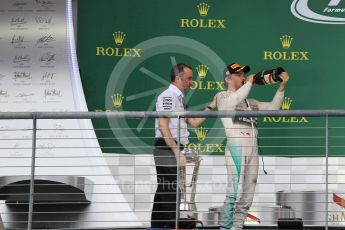 World © Octane Photographic Ltd. Mercedes AMG Petronas F1 W06 Hybrid - Nico Rosberg and Paddy Lowe. Sunday 25th October 2015, F1 USA Grand Prix Race - Podium, Austin, Texas - Circuit of the Americas (COTA). Digital Ref: 1467LB1D2948