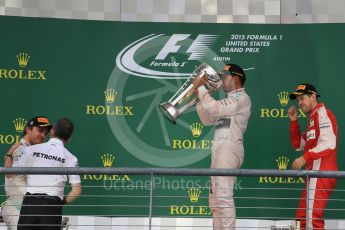 World © Octane Photographic Ltd. Mercedes AMG Petronas F1 W06 Hybrid – Lewis Hamilton, Nico Rosberg and Scuderia Ferrari SF15-T– Sebastian Vettel. Sunday 25th October 2015, F1 USA Grand Prix Race - Podium, Austin, Texas - Circuit of the Americas (COTA). Digital Ref: 1467LB1D2964
