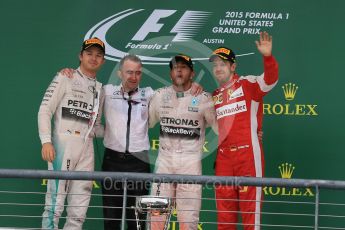 World © Octane Photographic Ltd. Mercedes AMG Petronas F1 W06 Hybrid – Lewis Hamilton, Nico Rosberg and Scuderia Ferrari SF15-T– Sebastian Vettel and Paddy Lowe from Mercedes AMG Petronas F1 team. Sunday 25th October 2015, F1 USA Grand Prix Race - Podium, Austin, Texas - Circuit of the Americas (COTA). Digital Ref: 1467LB1D3004