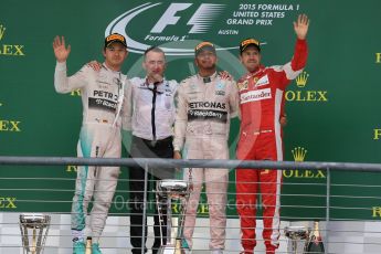 World © Octane Photographic Ltd. Mercedes AMG Petronas F1 W06 Hybrid – Lewis Hamilton, Nico Rosberg and Scuderia Ferrari SF15-T– Sebastian Vettel and Paddy Lowe from Mercedes AMG Petronas F1 team. Sunday 25th October 2015, F1 USA Grand Prix Race - Podium, Austin, Texas - Circuit of the Americas (COTA). Digital Ref: 1467LB1D3033