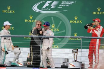World © Octane Photographic Ltd. Mercedes AMG Petronas F1 W06 Hybrid – Lewis Hamilton, Nico Rosberg and Scuderia Ferrari SF15-T– Sebastian Vettel being interviewed by Sir Elton John. Sunday 25th October 2015, F1 USA Grand Prix Race - Podium, Austin, Texas - Circuit of the Americas (COTA). Digital Ref: 1467LB1D3043