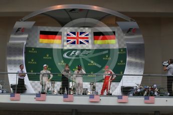 World © Octane Photographic Ltd. Mercedes AMG Petronas F1 W06 Hybrid – Lewis Hamilton, Nico Rosberg and Scuderia Ferrari SF15-T– Sebastian Vettel being interviewed by Sir Elton John. Sunday 25th October 2015, F1 USA Grand Prix Race - Podium, Austin, Texas - Circuit of the Americas (COTA). Digital Ref: 1467LB1D3079