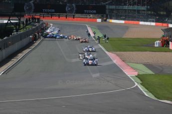 World © Octane Photographic Ltd. FIA World Endurance Championship (WEC), 6 Hours of Silverstone Race, UK, Sunday 12th April 2015. Toyota Racing – Toyota TS040 Hybrid - LMP1 - Anthony Davidson, Sebastien Buemi and Kazuki Nakajima then Audi Sport Team Joest- Audi R18 e-tron Quatrro - LMP1 - Andre Lotterer, Benoit Treluyer and Marcel Fassler. Digital Ref : 1225LB1D8515