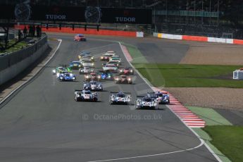 World © Octane Photographic Ltd. FIA World Endurance Championship (WEC), 6 Hours of Silverstone Race, UK, Sunday 12th April 2015. Porsche Team – Porsche 919 Hybrid - LMP1 - Timo Bernhard, Mark Webber and Brendon Hartley heads the pack in to turn 1. Digital Ref : 1225LB1D8609