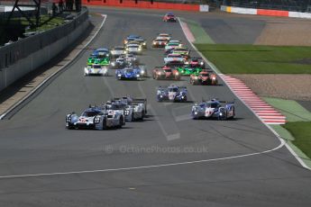 World © Octane Photographic Ltd. FIA World Endurance Championship (WEC), 6 Hours of Silverstone Race, UK, Sunday 12th April 2015. Porsche Team – Porsche 919 Hybrid - LMP1 - Timo Bernhard, Mark Webber and Brendon Hartley heads the pack in to turn 1. Digital Ref : 1225LB1D8617