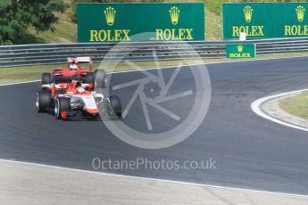 World © Octane Photographic Ltd. Manor Marussia F1 Team MR03B – William Stevens and Scuderia Ferrari SF15-T– Sebastian Vettel. Friday 24th July 2015, F1 Hungarian GP Practice 1, Hungaroring, Hungary. Digital Ref: 1346CB1L4693