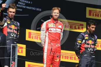 World © Octane Photographic Ltd. Scuderia Ferrari SF15-T– Sebastian Vettel, Infiniti Red Bull Racing RB11 – Daniil Kvyat and Daniel Ricciardo. Sunday 26th July 2015, F1 Hungarian GP Race - Podium, Hungaroring, Hungary. Digital Ref: 1361LB1D2834