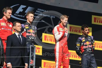 World © Octane Photographic Ltd. Scuderia Ferrari SF15-T– Sebastian Vettel, Infiniti Red Bull Racing RB11 – Daniil Kvyat and Daniel Ricciardo. Sunday 26th July 2015, F1 Hungarian GP Race - Podium, Hungaroring, Hungary. Digital Ref: 1361LB1D2851