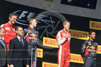 World © Octane Photographic Ltd. Scuderia Ferrari SF15-T– Sebastian Vettel, Infiniti Red Bull Racing RB11 – Daniil Kvyat and Daniel Ricciardo. Sunday 26th July 2015, F1 Hungarian GP Race - Podium, Hungaroring, Hungary. Digital Ref: 1361LB1D2864