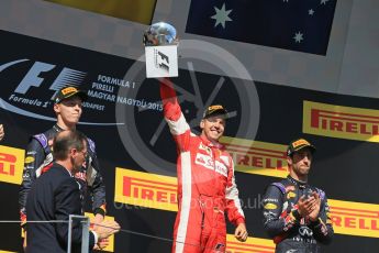 World © Octane Photographic Ltd. Scuderia Ferrari SF15-T– Sebastian Vettel, Infiniti Red Bull Racing RB11 – Daniil Kvyat and Daniel Ricciardo. Sunday 26th July 2015, F1 Hungarian GP Race - Podium, Hungaroring, Hungary. Digital Ref: 1361LB1D2967