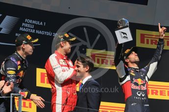 World © Octane Photographic Ltd. Scuderia Ferrari SF15-T– Sebastian Vettel, Infiniti Red Bull Racing RB11 – Daniil Kvyat and Daniel Ricciardo. Sunday 26th July 2015, F1 Hungarian GP Race - Podium, Hungaroring, Hungary. Digital Ref: 1361LB1D3040