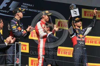 World © Octane Photographic Ltd. Scuderia Ferrari SF15-T– Sebastian Vettel, Infiniti Red Bull Racing RB11 – Daniil Kvyat and Daniel Ricciardo. Sunday 26th July 2015, F1 Hungarian GP Race - Podium, Hungaroring, Hungary. Digital Ref: 1361LB1D3044