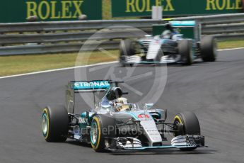 World © Octane Photographic Ltd. Mercedes AMG Petronas F1 W06 Hybrid – Lewis Hamilton and Nico Rosberg. Sunday 26th July 2015, F1 Hungarian GP Race, Hungaroring, Hungary. Digital Ref: 1360CB1L7436