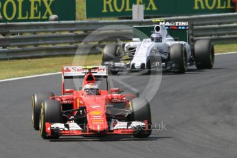 World © Octane Photographic Ltd. Scuderia Ferrari SF15-T– Kimi Raikkonen and Williams Martini Racing FW37 – Valtteri Bottas. Sunday 26th July 2015, F1 Hungarian GP Race, Hungaroring, Hungary. Digital Ref: 1360CB1L7552