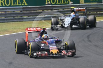 World © Octane Photographic Ltd. Scuderia Toro Rosso STR10 – Carlos Sainz Jnr and Sahara Force India VJM08B – Sergio Perez. Sunday 26th July 2015, F1 Hungarian GP Race, Hungaroring, Hungary. Digital Ref: 1360CB1L7579