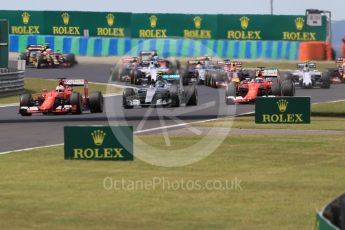 World © Octane Photographic Ltd. Scuderia Ferrari SF15-T– Sebastian Vettel and Kimi Raikkonen and Mercedes AMG Petronas F1 W06 Hybrid – Nico Rosberg. Sunday 26th July 2015, F1 Hungarian GP Race, Hungaroring, Hungary. Digital Ref: 1360CB1L7633