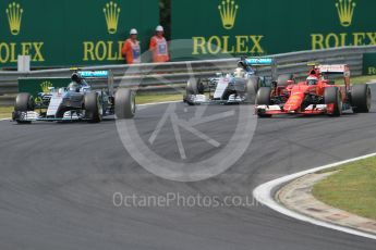 World © Octane Photographic Ltd. Scuderia Ferrari SF15-T– Kimi Raikkonen and Mercedes AMG Petronas F1 W06 Hybrid – Nico Rosberg and Lewis Hamilton. Sunday 26th July 2015, F1 Hungarian GP Race, Hungaroring, Hungary. Digital Ref: 1360CB1L7642